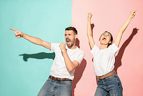 A couple of young man and woman dancing hip-hop at studio.