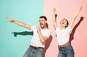 A couple of young man and woman dancing hip-hop at studio.