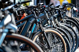 Row of modern electric bikes displayed for sale in a bicycle shop